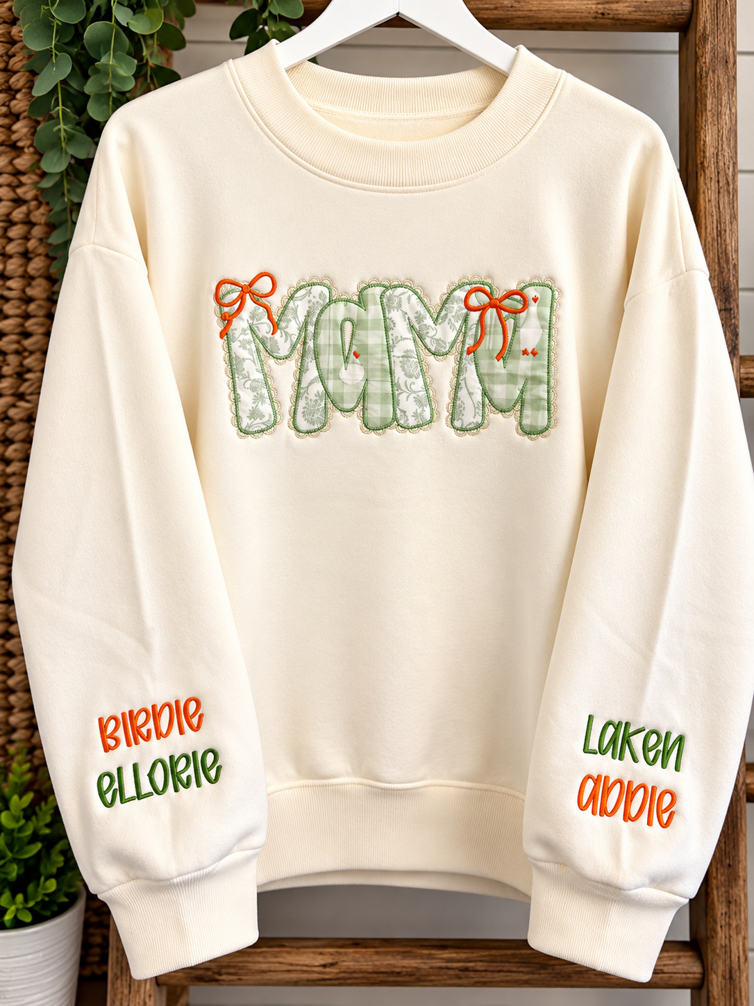 Cream Mama sweatshirt with embroidered names on sleeves